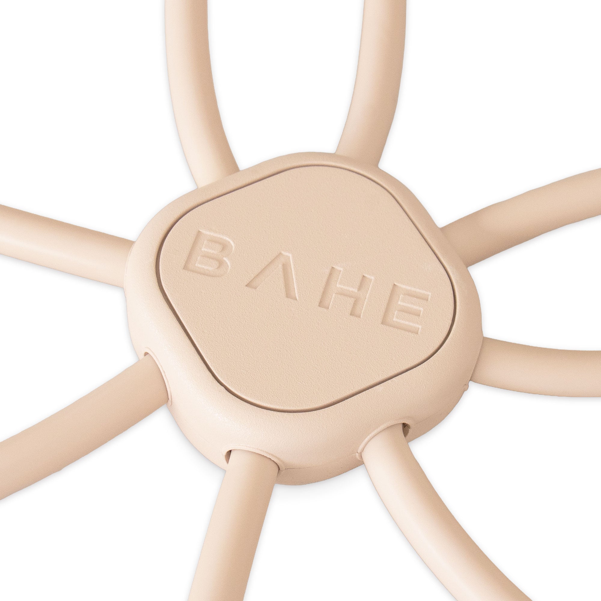 Close-up of a beige silicone hexagonal flow reformer piece embossed with the brand name BAHE.